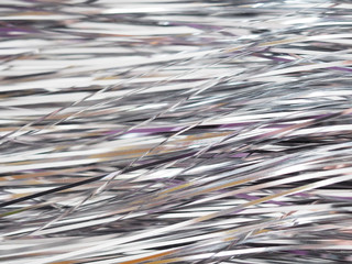 bright festive stripes silver background sparkles with glare, blurring the edges