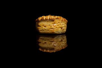 Small cornbread isolated on black background