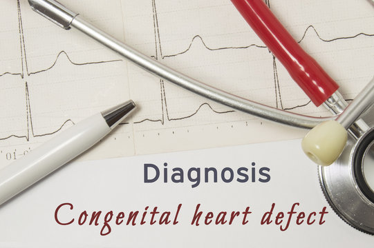 Cardiac diagnosis of Congenital Heart Defect. On doctor workplace is paper medical documentation, which indicated diagnosis of Congenital Heart Defect, surrounded by red stethoscope, ECG line close-up