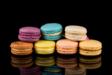 Colorful macaroon over black background