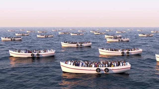 Refugees on boats floating on the sea