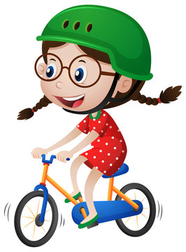 Little girl riding bike with helmet on