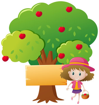 Little girl and red apple tree