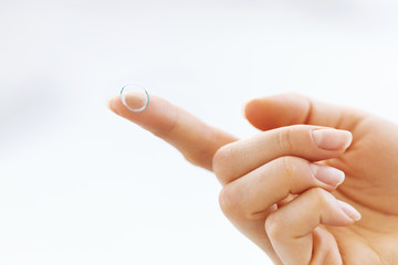 Woman Finger With Contact Eye Lens. Health Concept