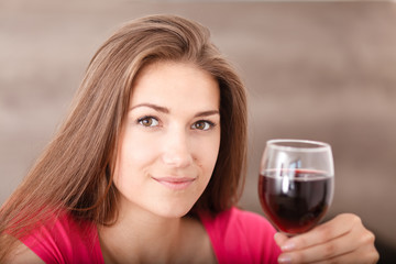 Portrait of a young girl and red wine