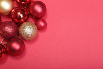 Red christmas balls on a red background