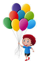 Little boy holding colorful balloons