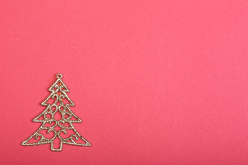 Fototapeta na wymiar Golden christmas fir tree decoration on glitter background