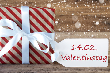Fototapeta na wymiar Present With Snowflakes, Text Valentinstag Means Valentines Day