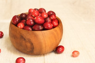 Fresh Cranberries in a wooden bowl