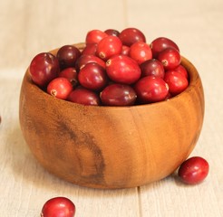 Fresh Cranberries in a wooden bowl
