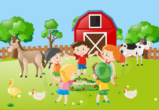 Children holding hands in circle in the farm