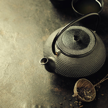 Teapot on vintage background