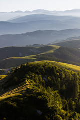 Panoramic view of mountains in the mist from Mount Grappa, Italy