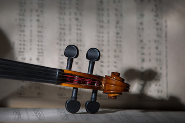 Vintage violin on the sheet music.
