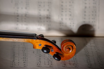 Fototapeta premium Vintage violin on the sheet music. 