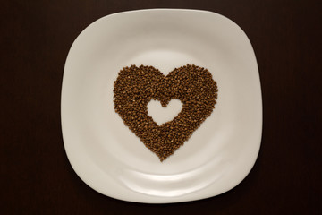 buckwheat laid out in the shape of a heart on a plate