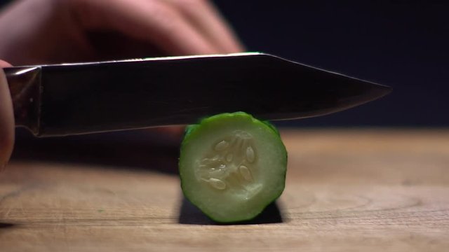 Woman Slicing Cucumber