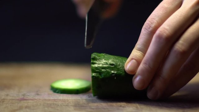 Chef Chopping a Cucumber Closeup Slow Motion