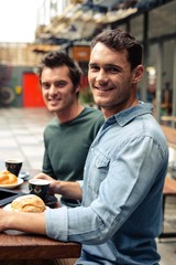 Happy friends having coffee together