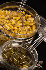 Cannabis extraction capsules infused with shatter and CBD oil on