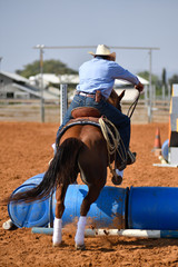 Cowboy jumping over barrels during the competition "Cowboy Extreme"