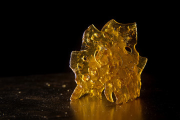 Close up detail of marijuana oil concentrate aka shatter