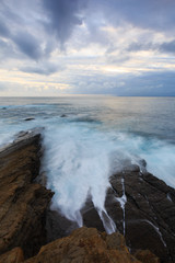 Dramatic clouds at sunrise on the coast of Castro Urdiales, Cantabria