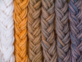 Braided wool yarn samples colored by henna and indigo