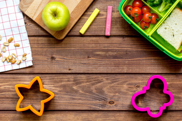 ingredients for children's lunch on wooden background top view