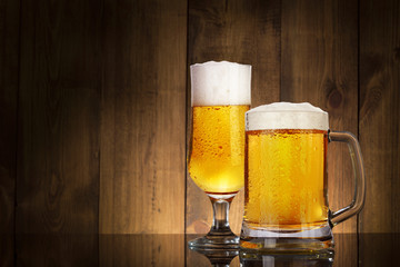 Glass beer on wood background with copyspace
