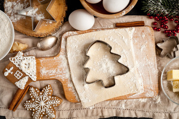 cooking christmas gingerbread on wooden background top view