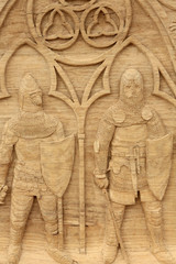 Fototapeta na wymiar Soldats médiévaux. Sculpture sur bois. 