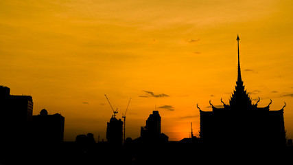 City silhouette in bangkok with golden sky background