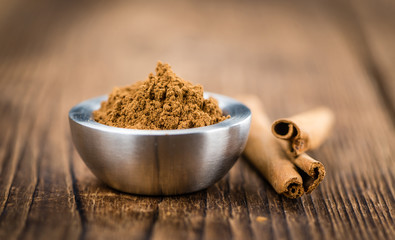 Wooden table with Cinnamon (selective focus)