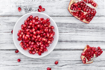 Wooden table with Pomegranate (selective focus)
