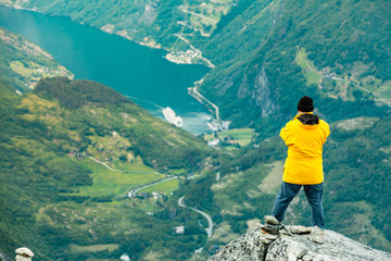 Naklejka premium Tourist man on Dalsnibba viewpoint Norway