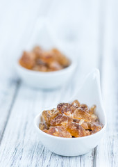 Brown Rock Candy on wooden background