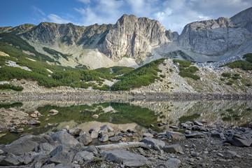 Landscape with Clouds over Sinanitsa Peak and reflectionin the lake, Pirin Mountain, Bulgaria