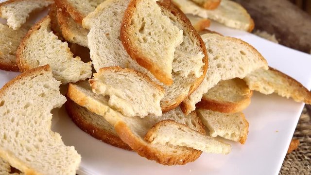 Portion of rotating Bread Chips as seamless loopable 4K UHD footage
