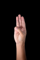 male hand Holds three fingers isolated on black