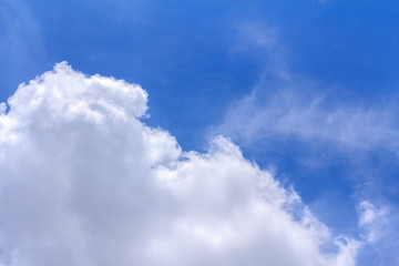 Blue sky background with white clouds. The vast blue sky and clouds sky on sunny day. White fluffy clouds in the blue sky.