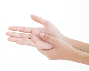 A woman massaging painful hand on a white background