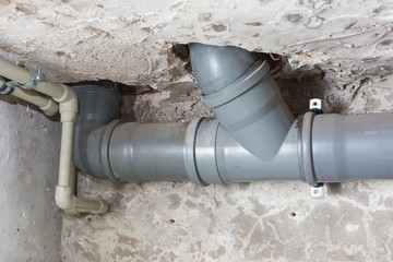 Sewer pipes in home basement - 128108967