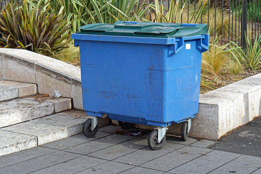 Blue trash container