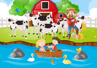 Naklejka premium Farmer and cows in the farm