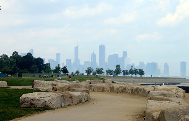 Hazy Chicago Skyline in a Distance; View From a Park by the Lake