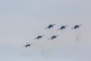 Fighter Sukhoi Su-27 show aerobatics at an airshow Russian Knights.