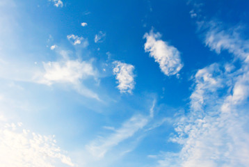 Naklejka na ściany i meble Blue sky clouds background.