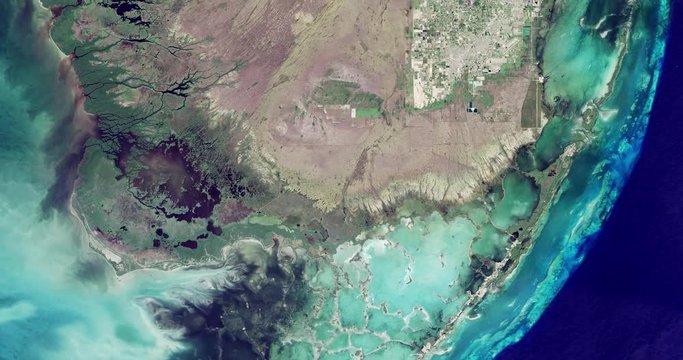 High-altitude overflight aerial of coastal marshland in the Florida everglades. Clip loops and is reversible. Elements of this image furnished by NASA 